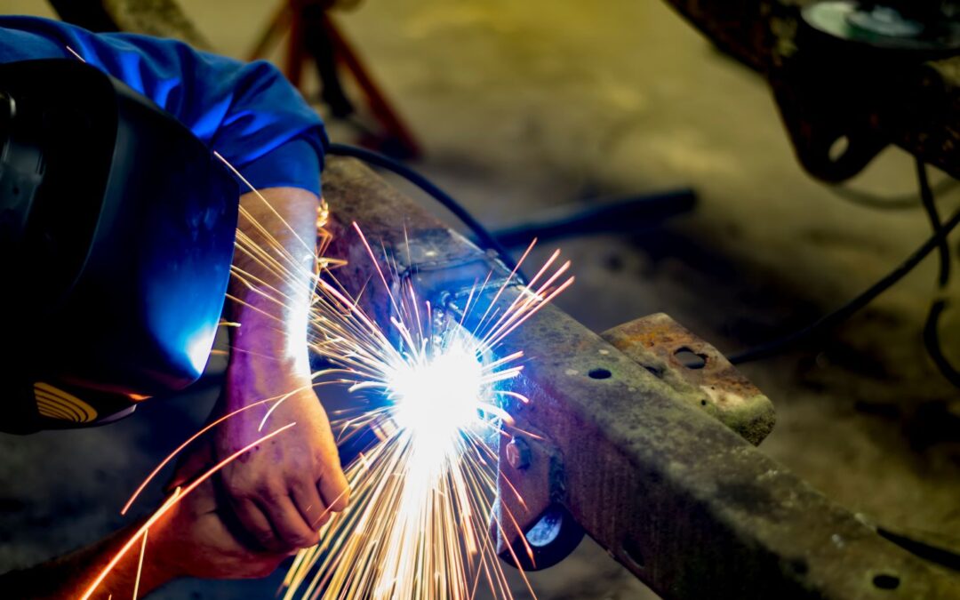 technician welding a bent car frame newark ohio